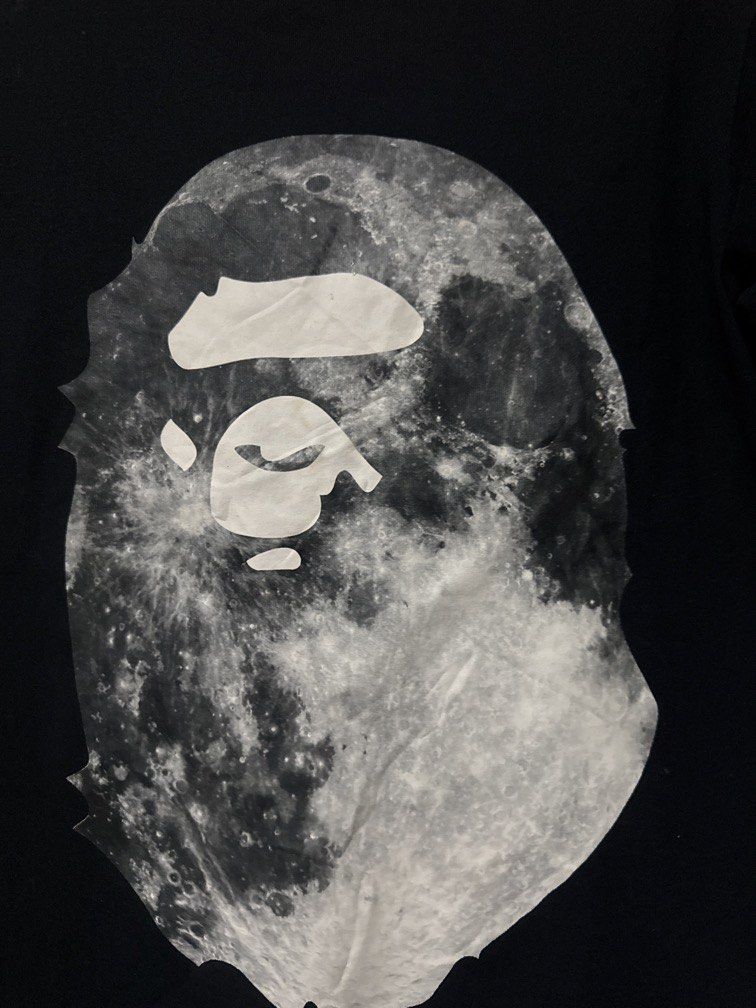 Bape Big Head Tee (Category: Tshirts & Polo Shirts ) located in Danao, Cebu. Submitted by welvirinec29053 (Listing ID 1465777342, Image 2). Description: This appears to be a black A Bathing Ape (BAPE) Mid-Autumn Festival special edition graphic t-shirt featuring an ape head filled with a moon surface texture. size small dimes 18x26 color 9.8/10.