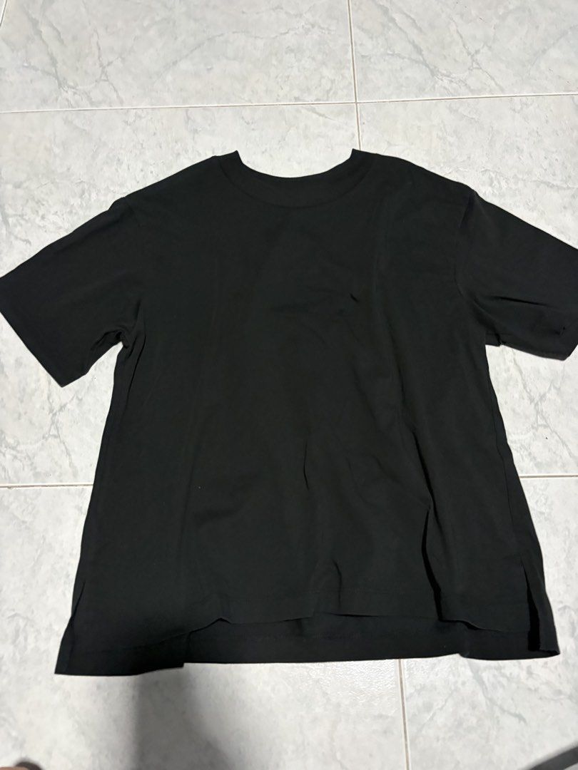 Basic Tee (Category: Tshirts & Polo Shirts) located in Singapore. Submitted by frglvrs_ (Listing ID 1465883868, Image 1). Description: - Color: Solid black - Design: Crew neck, short sleeves, clean minimal look - Fit: Relaxed fit with side slits at the hem for easy movement - Material: Soft, comfortable cotton for all-day wear - Versatile: Pairs effortlessly with jeans or joggers.
