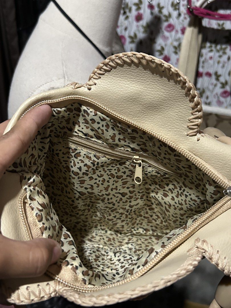 Beige floral laser-cut circular patchwork handbag | Fairy | Whimsy (Category: Cross-body Bags) located in Los Banos. Submitted by samsukehiro (Listing ID 1465773211, Image 2). Description: - Color: Versatile beige - Design: Stylish overlapping circular patches with intricate floral laser-cut details - Straps: Comfortable dual top handles in matching faux leather - Closure: Secure zipped main compartment - Interior: Fun leopard print fabric lining
