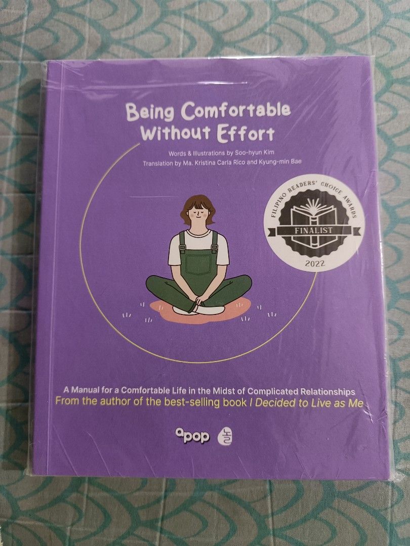 Being Comfortable Without Effort by Soo-hyun Kim (Category: Storybooks) located in Taguig. Submitted by joeeey23 (Listing ID 1465820631, Image 1). Description: - Title: Being Comfortable Without Effort - Author/Illustrator: Soo-hyun Kim - Translators: Ma. Kristina Carla Rico and Kyung-min Bae - Publisher: apop - Format: Paperback with purple cover (features a person sitting cross-legged) - Subtitle: A Manual for a Comfortable Life in the Midst of