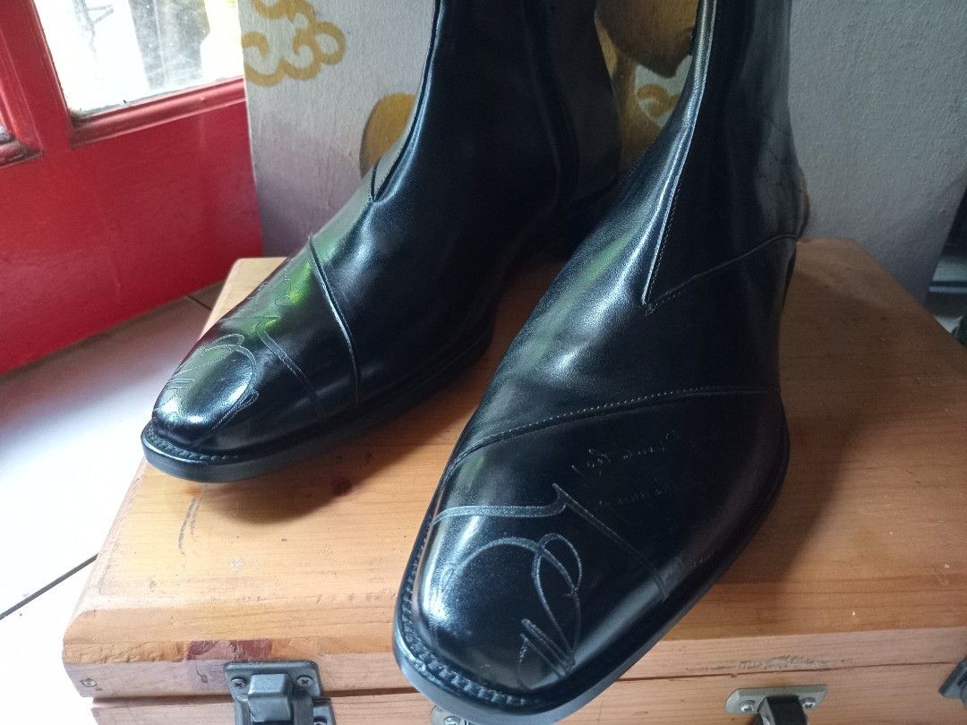 Berluti Black Leather Script Print Chelsea Boots (Category: Boots) located in Cagayan de Oro. Submitted by joven.uy86-31596 (Listing ID 1465825757, Image 1). Description: - Style: Statement black leather boots with striking script calligraphy print - Closure: Convenient side zipper for easy wear - Design: Structured toe cap and clean stacked heel - Finish: Polished look with distinctive pattern details throughout - Condition: Brand new / Excellen