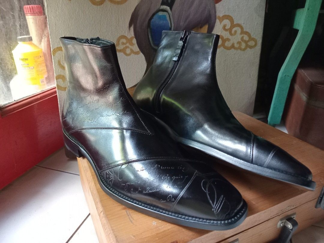 Berluti Black Leather Script Print Chelsea Boots (Category: Boots) located in Cagayan de Oro. Submitted by joven.uy86-31596 (Listing ID 1465825757, Image 2). Description: - Style: Statement black leather boots with striking script calligraphy print - Closure: Convenient side zipper for easy wear - Design: Structured toe cap and clean stacked heel - Finish: Polished look with distinctive pattern details throughout - Condition: Brand new / Excellen