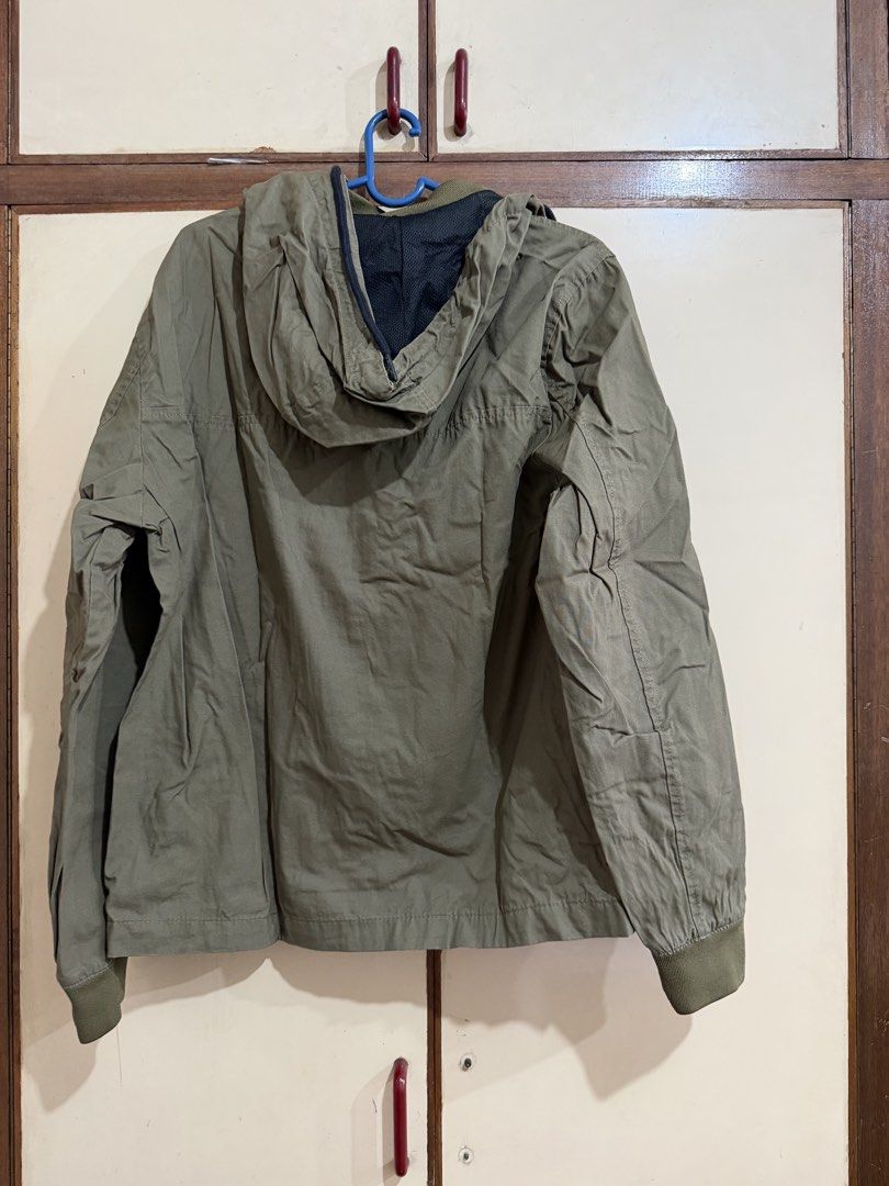 Bershka Olive Green Hooded Jacket Size M (Category: Coats, Jackets and Outerwear) located in Manila. Submitted by preloved_new_forsale (Listing ID 1465920458, Image 2). Description: Bershka hooded jacket in olive green. Medium size, EUR M, USA M, MEX 38. Full zip closure up front with dark drawstrings on the hood. Ribbed cuffs and hem. Black mesh lining inside. Made in Bangladesh. Good layer for cooler weather..