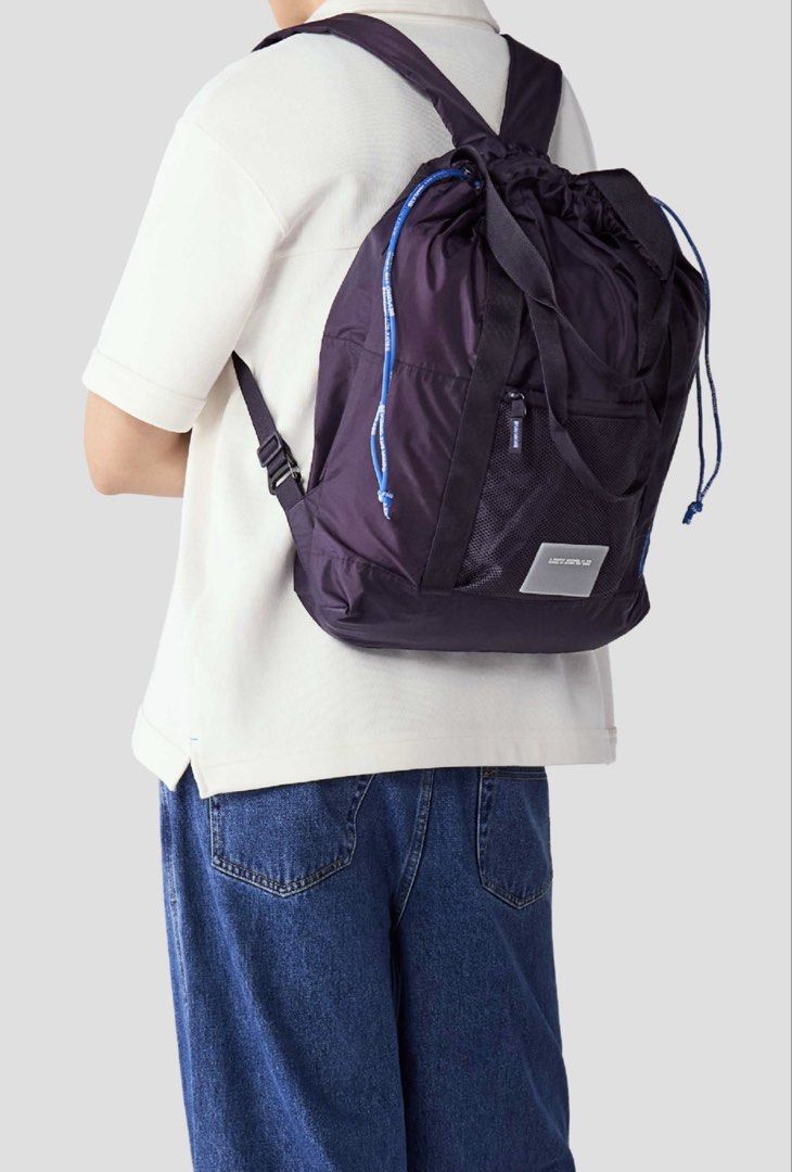 Beyond The Vines ParaPack 002 - Dark Plum (Category: Backpacks) located in Antipolo. Submitted by prelovedniandy (Listing ID 1465848818, Image 3). Description: - Brand: Beyond The Vines - Color: Dark Plum - Style: Convertible bag (wear as a backpack or carry by top handles) - Features: Drawstring top closure, front mesh pocket with zipper, branded patch near the base, and adjustable shoulder straps - Condition: Excellent / Well-maintained - Best 