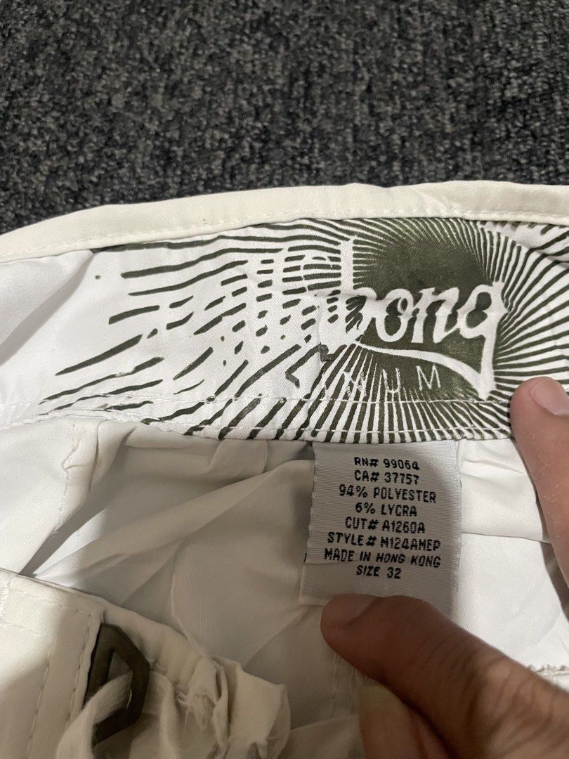 Billabong White Board Shorts Size 32 (Category: Swim Trunks & Board Shorts) located in Cebu City. Submitted by lucky.finds.ph (Listing ID 1465797191, Image 3). Description: - Brand: Billabong - Color: White - Size: 32 - Material: 94% Polyester, 6% Lycra for stretch and comfort - Features: Embroidered leg logo, practical side cargo pocket, and secure velcro fly closure - Condition: Heavily worn with fabric tearing around the waistband (please chec