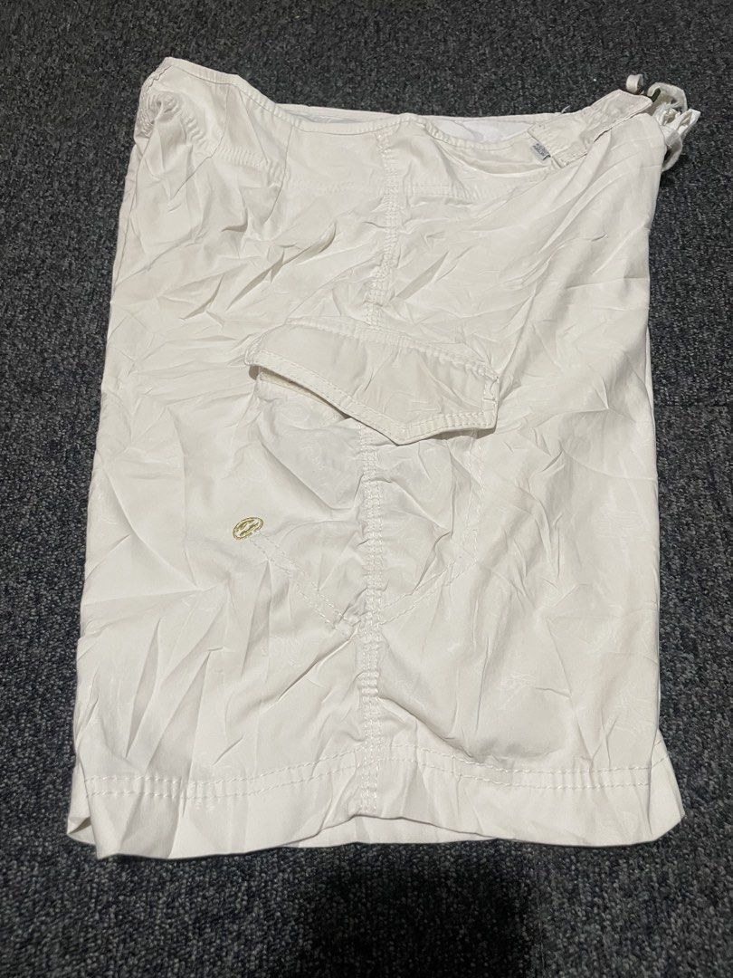 Billabong White Board Shorts Size 32 (Category: Swim Trunks & Board Shorts) located in Cebu City. Submitted by lucky.finds.ph (Listing ID 1465797191, Image 2). Description: - Brand: Billabong - Color: White - Size: 32 - Material: 94% Polyester, 6% Lycra for stretch and comfort - Features: Embroidered leg logo, practical side cargo pocket, and secure velcro fly closure - Condition: Heavily worn with fabric tearing around the waistband (please chec