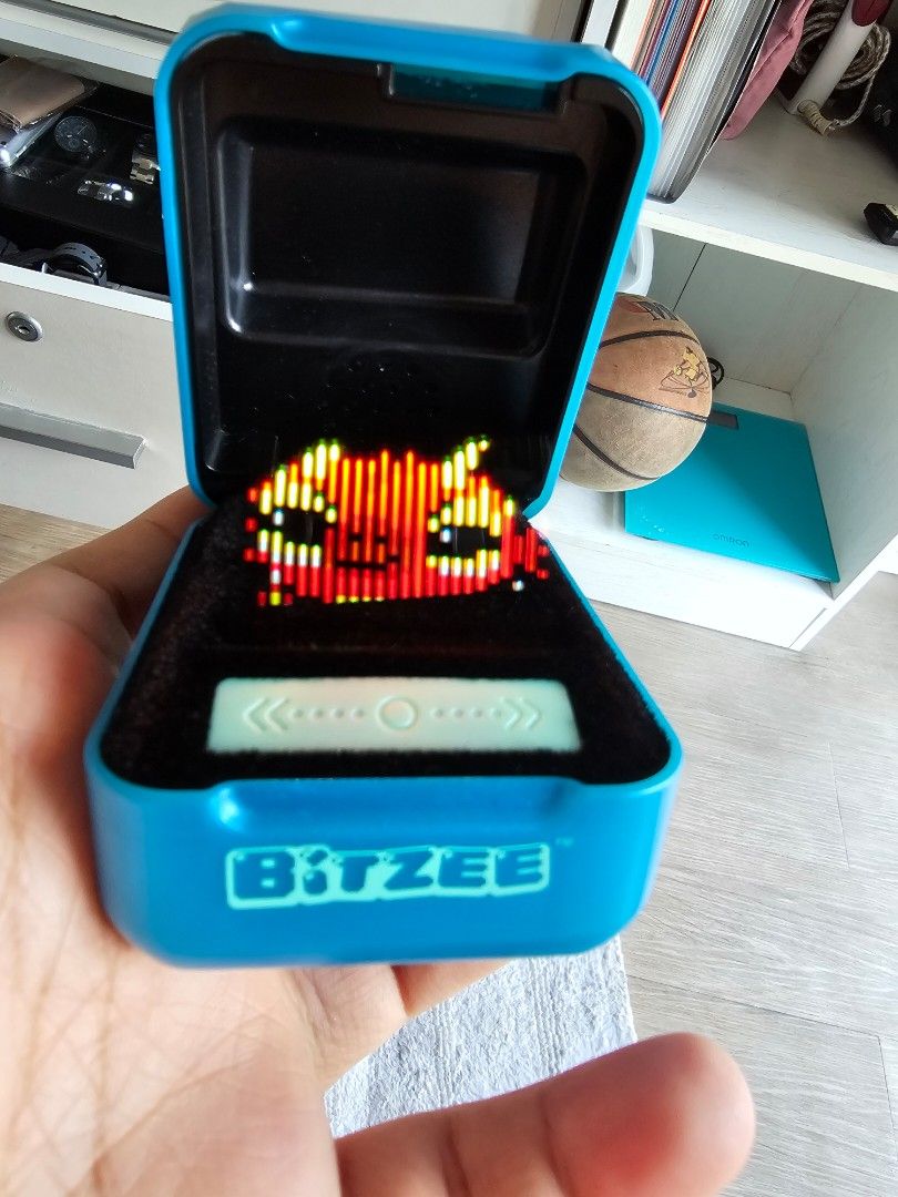 Bitzee Interactive Digital Pet Toy Blue (Category: Interactive Toys) located in Manila. Submitted by meij102639928 (Listing ID 1465764195, Image 2). Description: - Authentic Bitzee Interactive Digital Pet (Blue edition) - Features a unique flexible LED screen with pixelated virtual characters - Interactive play: swipe, tilt, and touch the sensor strip to care for your pet - Compact and engaging electronic gadget, perfect for kids and collectors -