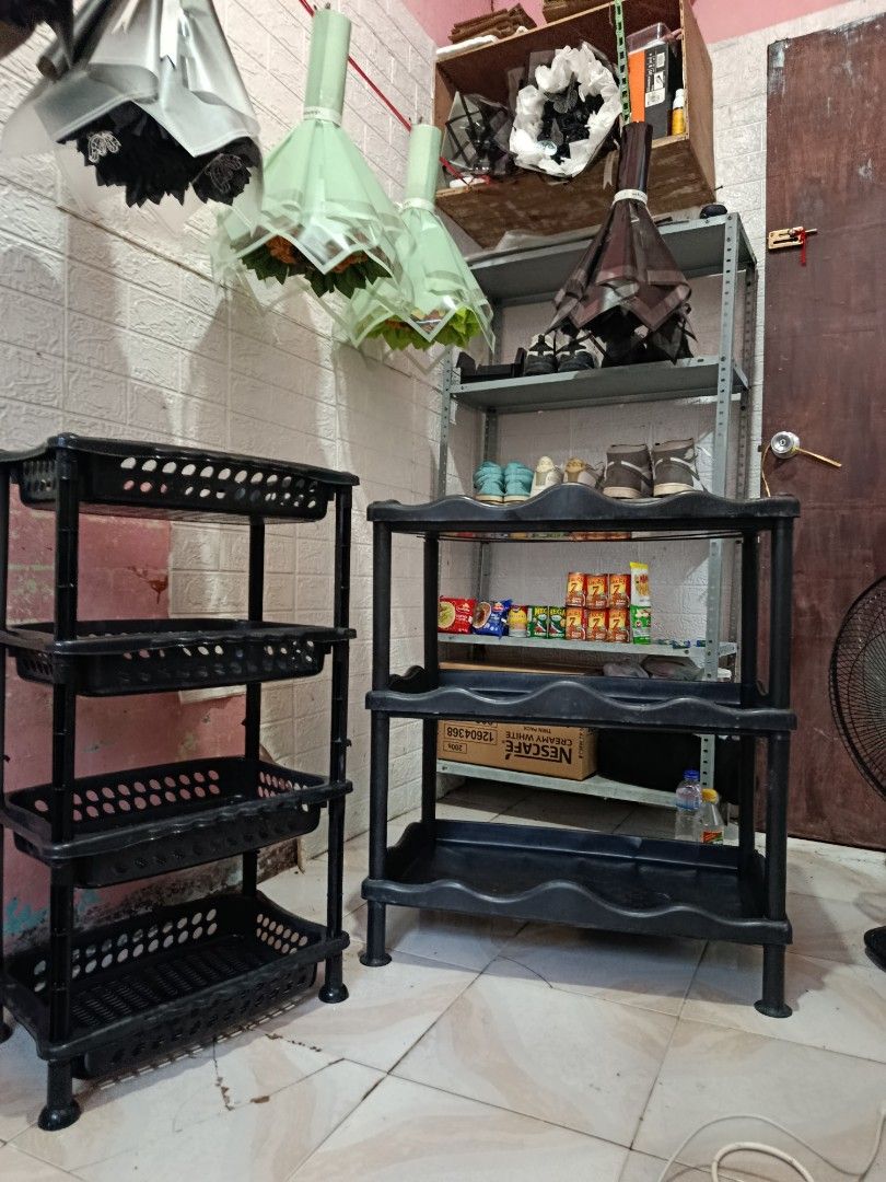 Black 4-tier plastic storage rack organizer (Category: Shelves, Cabinets & Racks) located in Santa Rosa. Submitted by magicsawap_ (Listing ID 1465939649, Image 1). Description: - Color: Black - Material: Sturdy plastic with 4 open baskets - Mobility: Lightweight and easy to move around - Versatile: Great for kitchen supplies, bathroom essentials, and pantry items - Space-saving: Good height to fit under counters or tuck into corners.