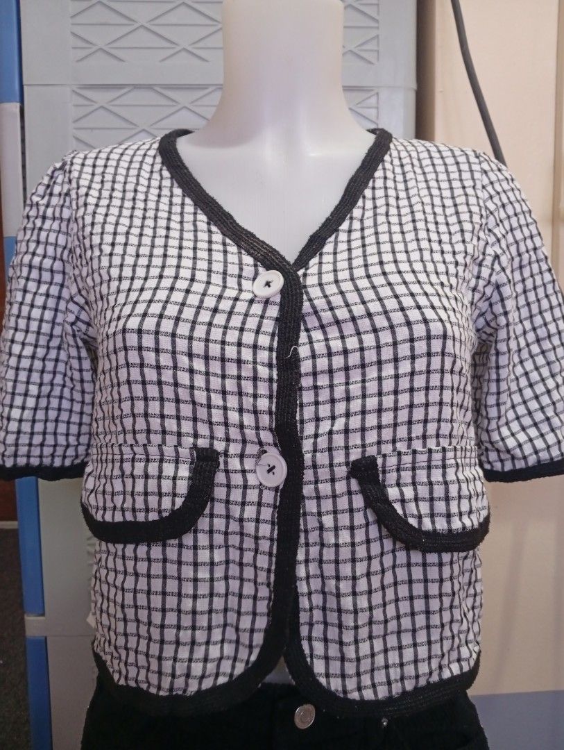 Black and White Gingham Short Sleeve Crop Blouse (Category: Blouses) located in Lingayen. Submitted by bela_24 (Listing ID 1465797185, Image 1). Description: - Stylish black and white check pattern - Trendy short sleeves with puff shoulders - Flattering deep V-neck cut with dark trim - Two front pockets with button accents and two white front buttons - Cropped length with a nice, fitted silhouette - Perfect for OOTDs and casual outings - PM for m