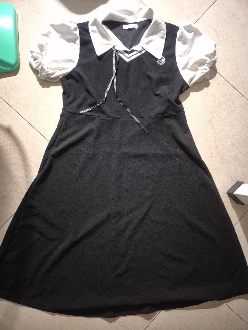 Black and White Sailor Collar Dress (Category: Dresses) located in Manila. Submitted by abianne (Listing ID 1465932241, Image 1). Description: - Color: Black with contrasting white details - Style: Midi dress with short puff sleeves and sailor collar - Accents: V-neck overlay and decorative chest ribbon - Comfort: Soft, lightweight fabric for all-day wear.