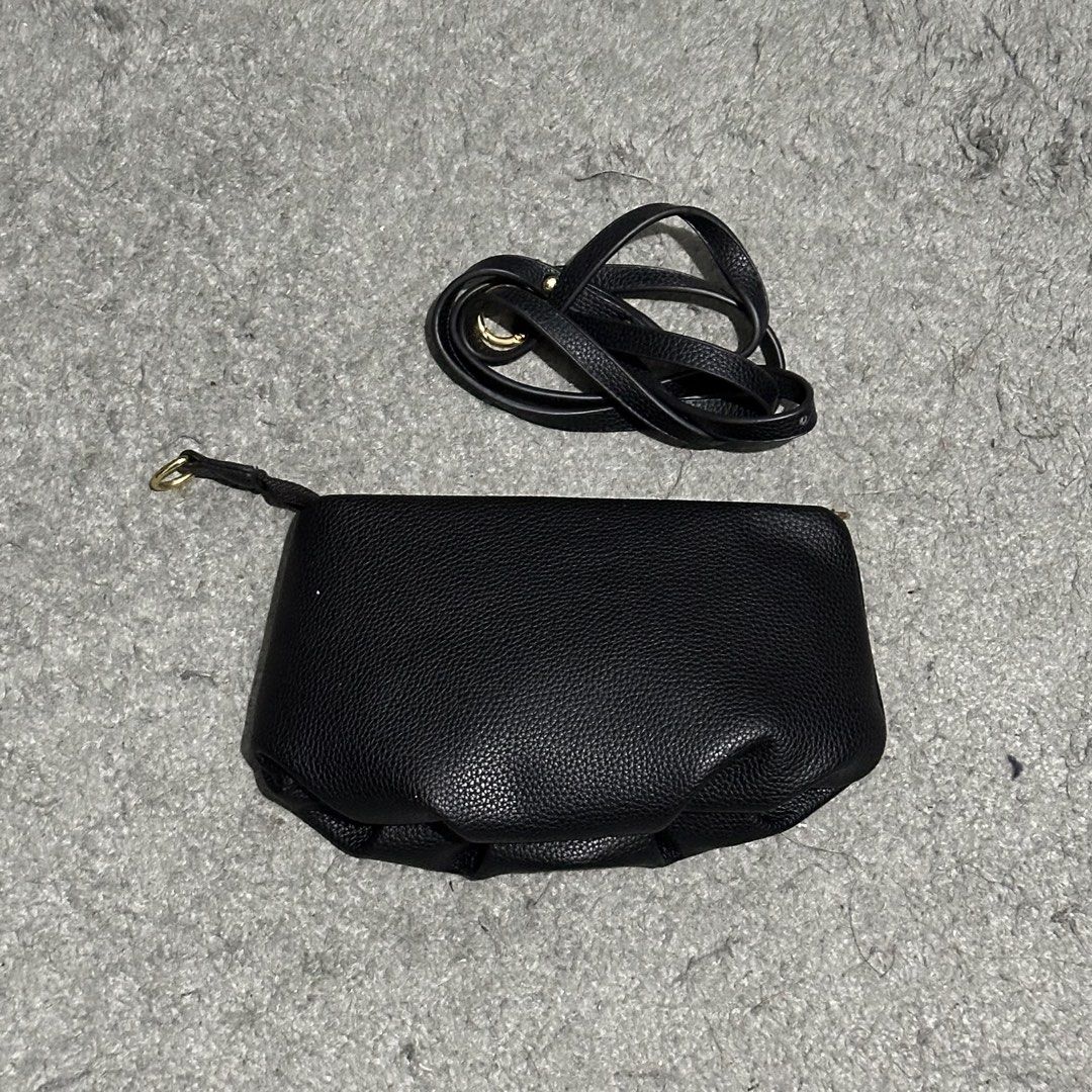 Black Crossbody Bag with Removable Strap (Category: Cross-body Bags) located in Lipa City. Submitted by jecoparra (Listing ID 1465841871, Image 3). Description: - Color: Black - Material: Faux leather with textured pebble grain finish - Hardware: Elegant gold-tone accents - Closure: Secure top zipper - Versatility: Can be worn as a crossbody or carried by hand - Straps: Includes a detachable long strap and a stylish short gold chain accent.