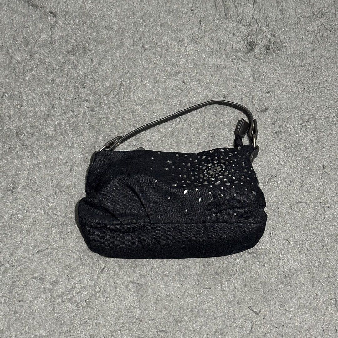 Black Denim Shoulder Bag with Rhinestone Detailing (Category: Shoulder Bags) located in Lipa City. Submitted by jecoparra (Listing ID 1465842082, Image 1). Description: - Style: Black denim shoulder bag with a soft, slouchy design - Detailing: Sparkling rhinestone starburst pattern on the front - Straps & Hardware: Short dark brown strap with sleek silver hardware - Storage: Main compartment for daily essentials plus a full-width back zippered po