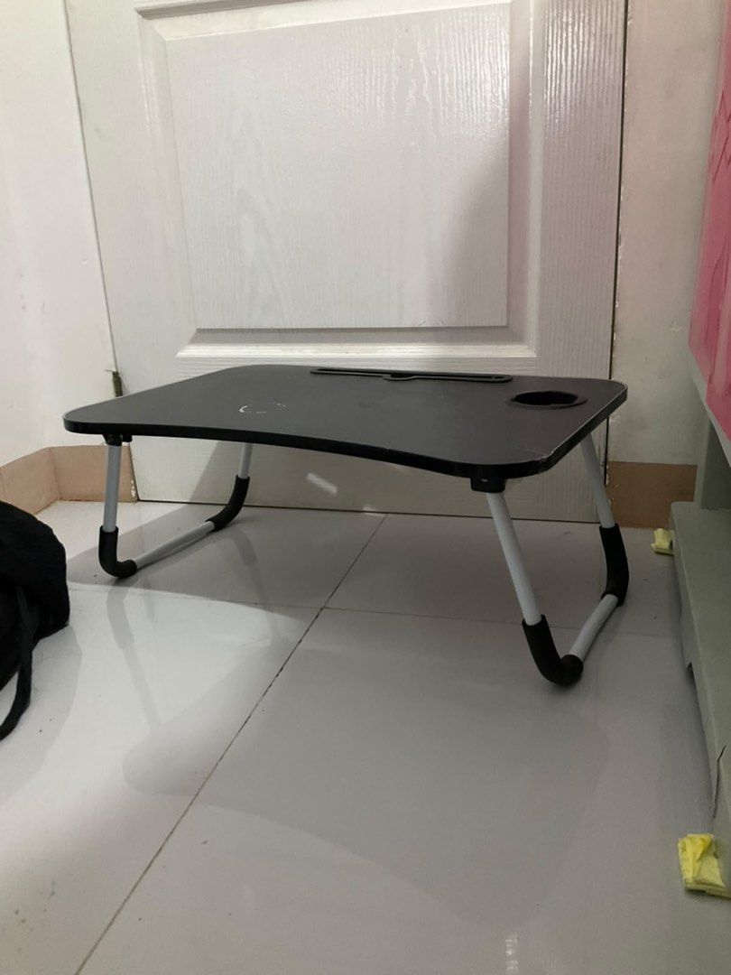 Black Foldable Lazy Bed Desk with Cup Holder (Category: Tables & Sets) located in Jaen. Submitted by blaire.mayoph (Listing ID 1465932669, Image 1). Description: 2ND HAND FOLDABLE LAPTOP TABLE / BED TABLE | ₱180 ONLY Selling this 2nd hand foldable laptop/bed table for only ₱180. Used only a few times and still in good condition. RFS: Mas ginagamit ko na kasi ang PC ko, kaya natatambak lang ito. Sayang naman kung hindi magamit ng iba. 😊 ✨ Feature