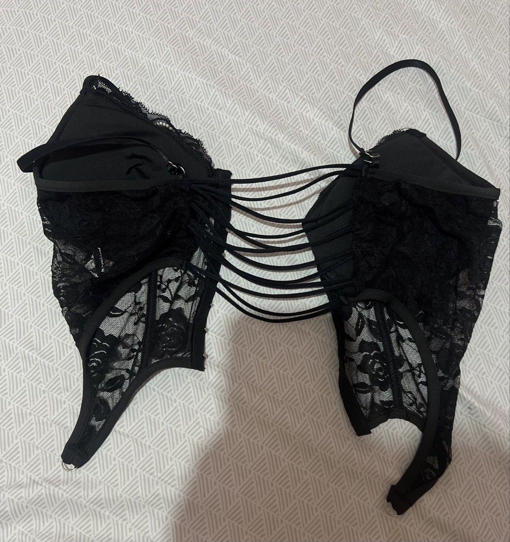 Black Lace Corset Top with Strappy Back (Category: Sleeveless) located in Manila. Submitted by kaceylgt (Listing ID 1465924353, Image 2). Description: - Condition: Brand new with tags (never worn) - Design: Black floral lace pattern with an asymmetrical pointed hem - Fit & Support: Adjustable shoulder straps and soft fabric lining inside cups - Closure: Front hook-and-eye closure - Back Details: Multiple elastic straps crossing over.