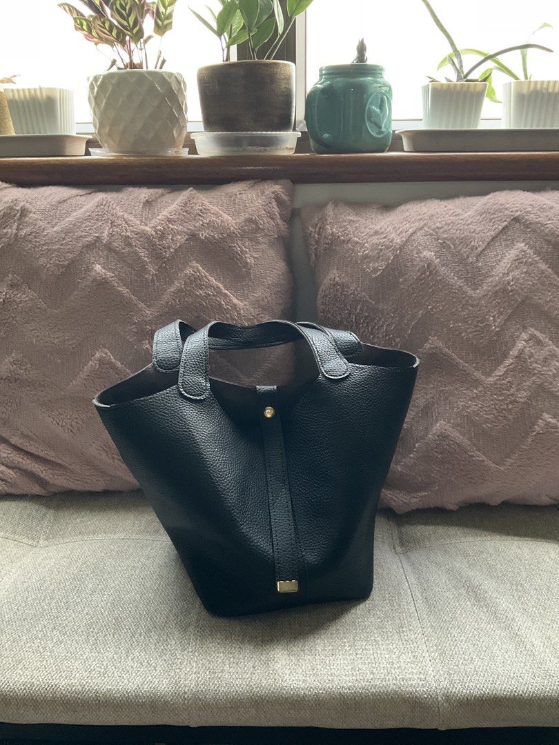 Black leather bucket bag with gold hardware (Category: Shoulder Bags) located in Quezon City. Submitted by freshspaces (Listing ID 1465776027, Image 1). Description: Decluttering.