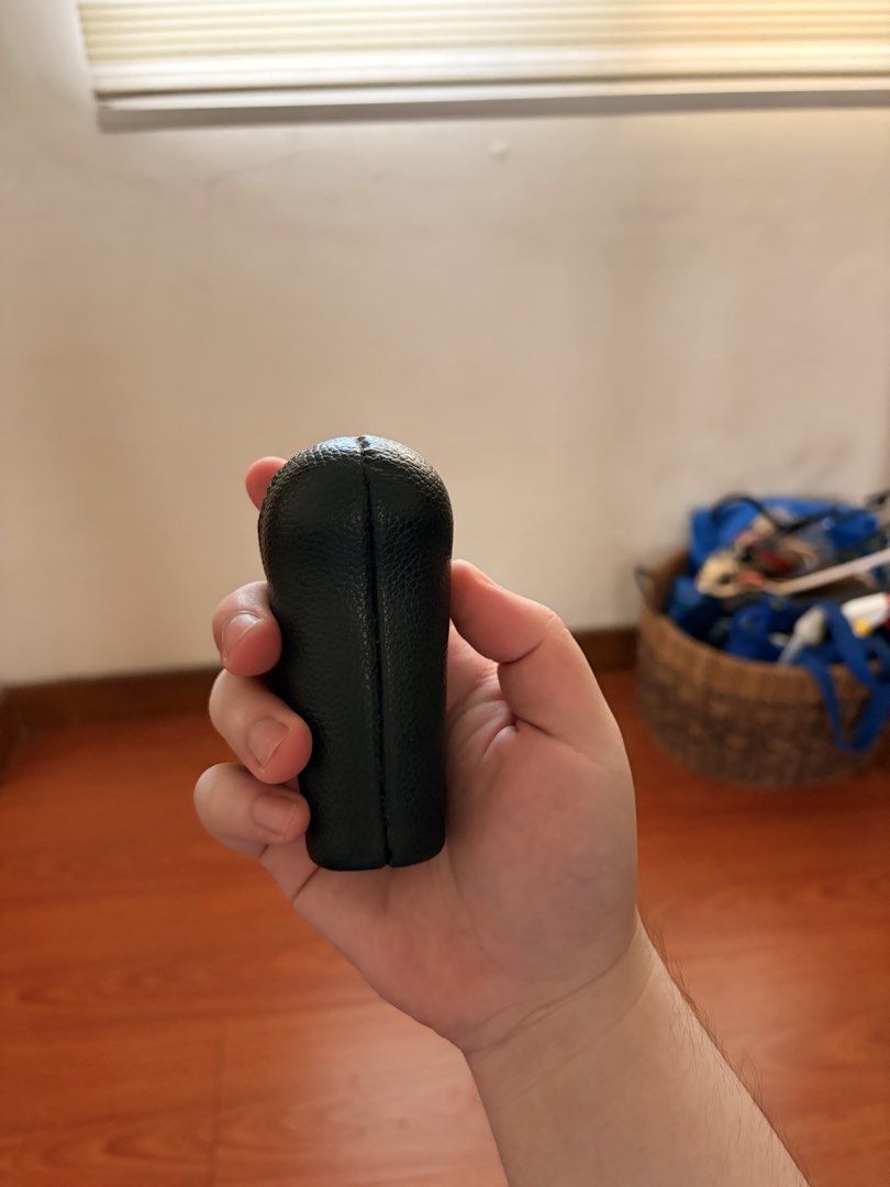 Black Leather Manual Gear Shift Knob (Category: Steering, Brakes, Control Parts and Accessories) located in Binan City. Submitted by spec.a (Listing ID 1465817797, Image 2). Description: - Genuine black leather-wrapped automatic gear shift knob - Stylish textured pebble grain finish with clean side stitching - Standard threaded bottom opening for easy and secure installation - Solid, ergonomic grip for a more comfortable driving experience - Flaw