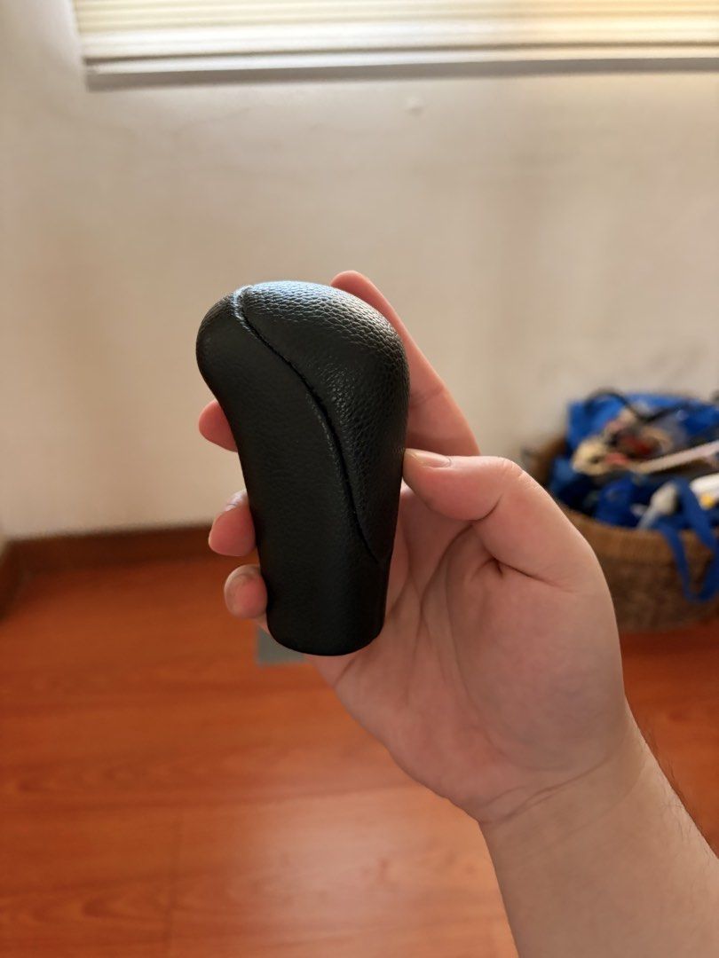 Black Leather Manual Gear Shift Knob (Category: Steering, Brakes, Control Parts and Accessories) located in Binan City. Submitted by spec.a (Listing ID 1465817797, Image 1). Description: - Genuine black leather-wrapped automatic gear shift knob - Stylish textured pebble grain finish with clean side stitching - Standard threaded bottom opening for easy and secure installation - Solid, ergonomic grip for a more comfortable driving experience - Flaw