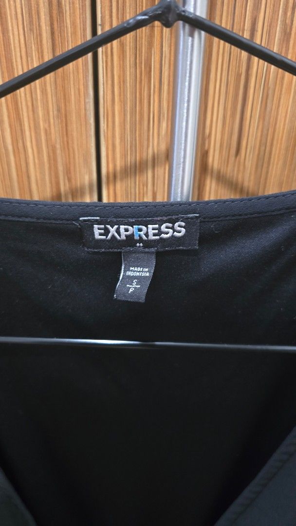 Black Long Sleeve Dress (Category: Dresses) located in Cebu City. Submitted by kitty_12345_ (Listing ID 1465908096, Image 3). Description: - Brand: Express - Size: Small - Color: Black - Origin: Made in Indonesia - Design: V-neck wrap style with gathered waistline and flowy skirt - Sleeves: Long sleeves with elastic cuffs - Fabric: Lightweight and comfortable - Occasion: Perfect for work, dinners, or casual outings MOP: gcash, mari, maya, gotyme 