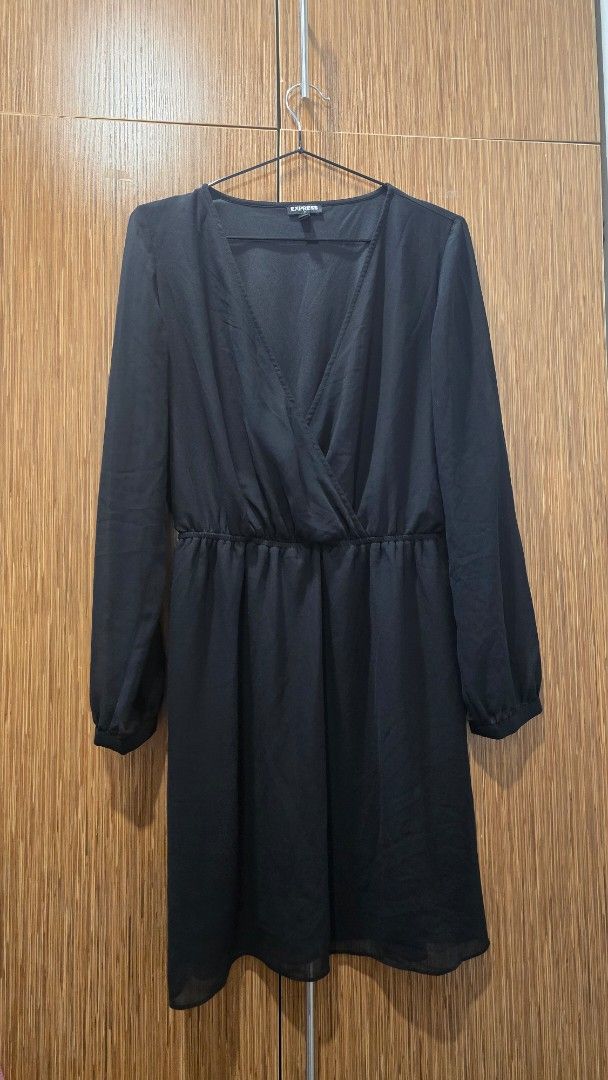 Black Long Sleeve Dress (Category: Dresses) located in Cebu City. Submitted by kitty_12345_ (Listing ID 1465908096, Image 1). Description: - Brand: Express - Size: Small - Color: Black - Origin: Made in Indonesia - Design: V-neck wrap style with gathered waistline and flowy skirt - Sleeves: Long sleeves with elastic cuffs - Fabric: Lightweight and comfortable - Occasion: Perfect for work, dinners, or casual outings MOP: gcash, mari, maya, gotyme 