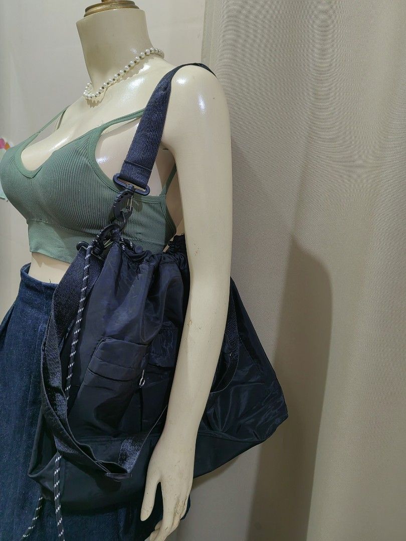 Black Nylon Utility Shoulder Bag with Multiple Pockets (Category: Shoulder Bags) located in Makati City. Submitted by prelovedtreatedwithlove (Listing ID 1465829496, Image 1). Description: Black nylon shoulder bag, roomy interior. Drawstring closure on top. Multiple exterior pockets with ring pull zippers. 2 ways good for daily errands or casual outings. No issue A-240.