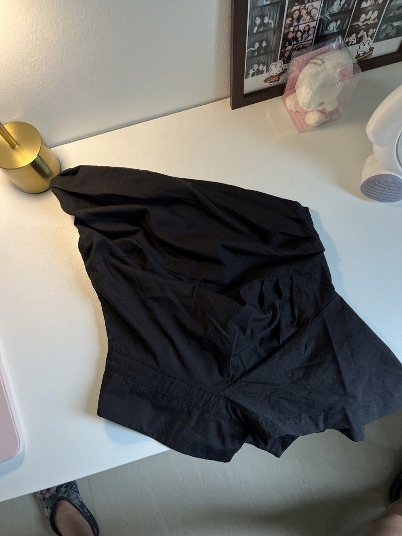 Black One-Shoulder Asymmetrical Draped Top (Category: Sleeveless) located in Bacolod City. Submitted by miffywhitematcha (Listing ID 1465911850, Image 2). Description: - Color: Black - Design: One-shoulder with elegant draped detailing and a playful ruffled hem - Fit: Sleeveless with a flattering tailored waist - Closure: Convenient side zip - Fabric: Lightweight and comfortable - Condition: Brand new / Excellent.