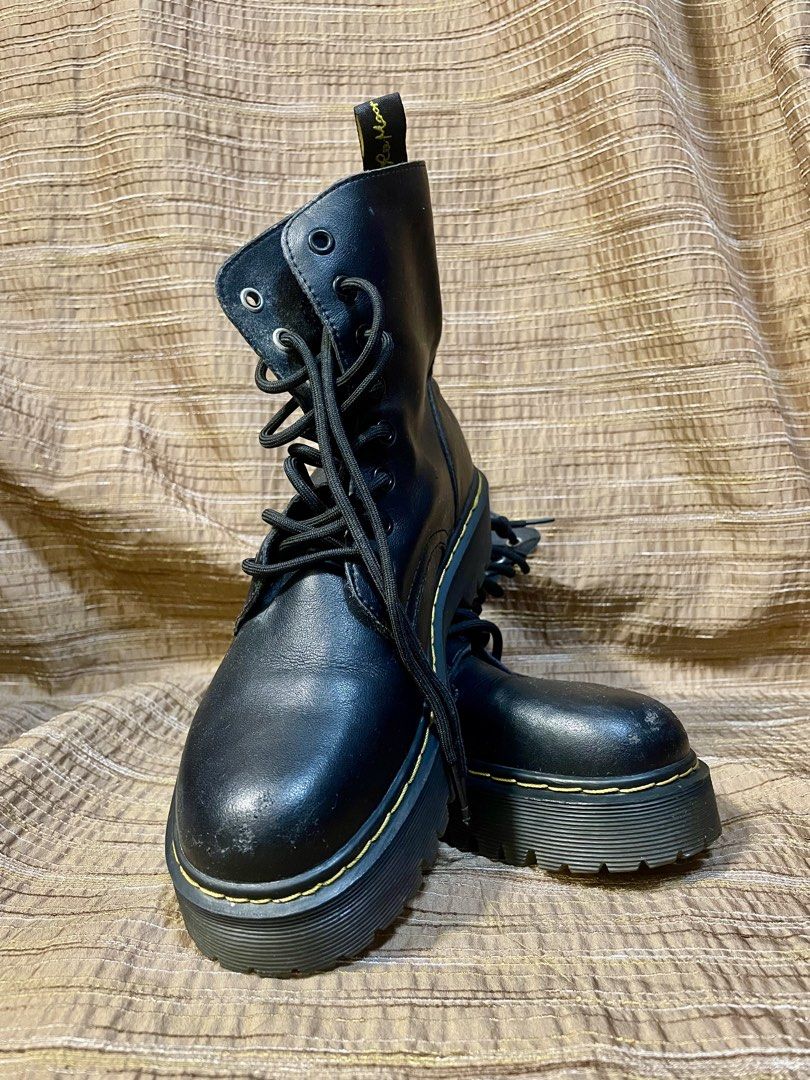 Black platform lace-up combat boots (Category: Casual Shoes) located in Manila. Submitted by phil.fabulous (Listing ID 1465850512, Image 2). Description: Black combat boots with chunky platform lug soles. Yellow contrast stitching along the welt. Round toes, black laces, metal eyelets. Pull tabs at the back heel with yellow lettering reading Born For Travel. Some minor scuffing on the toes from previous wear. Sturdy rubber soles, ready for more w