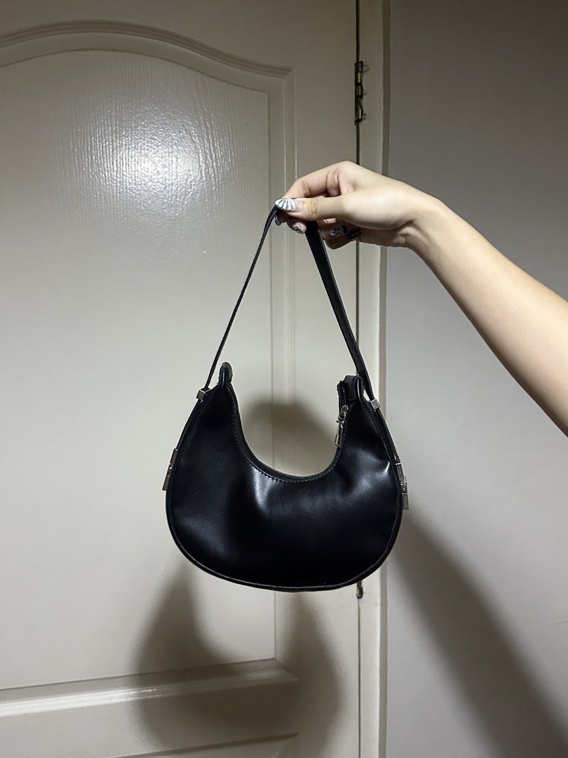 Black Shoulder Bag (Category: Shoulder Bags) located in Quezon City. Submitted by kel4k (Listing ID 1465875548, Image 1). Description: Can slightly extend straps using the silver buckles. .
