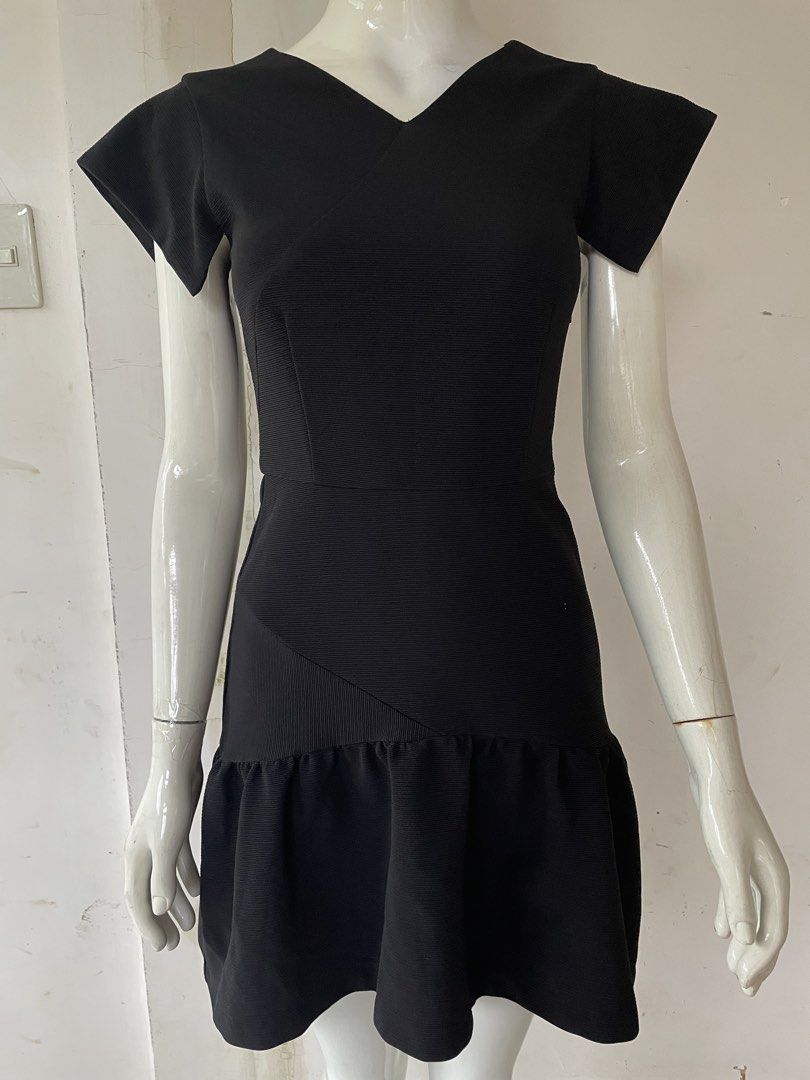 Black V-neck Mini Dress with Ruffle Hem (Category: Dresses) located in Pasay City. Submitted by anything_preloved23 (Listing ID 1465923406, Image 1). Description: - Black structured mini dress with short flared sleeves and ruffled hem - Fit: Fitted waistline for a flattering silhouette - Details: Textured fabric, back keyhole with button closure, and hidden lower back zipper - Condition: Excellent .