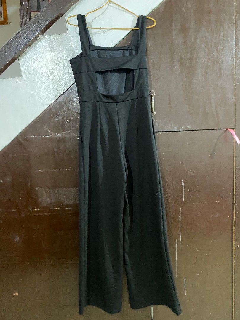 Black Wide-Leg Jumpsuit (Category: Jumpsuits) located in Manila. Submitted by zealdog.657924 (Listing ID 1465933587, Image 2). Description: Size: Medium - Large Style: Sleeveless Wide-Leg Jumpsuit Neckline: Square Neck Back: Elegant Open-Back Design Fit: Tailored Waist with Relaxed Wide-Leg Pants Closure: Back Zipper Fabric: Soft, comfortable & slightly stretchable Length: Full Length Condition: Excellent / Gently Used.