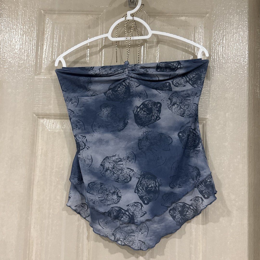 Blue abstract print halter tube top (Category: Sleeveless) located in Makati City. Submitted by julyco. (Listing ID 1465809167, Image 1). Description: - Style: Halter tube top with blue and grey abstract print - Details: Ruched front neckline with thin beaded center strap - Hem: Asymmetrical curved hem with lettuce-edge finish - Fabric: Sheer, lightweight, and breathable - Versatility: Perfect for summer nights or easy layering.
