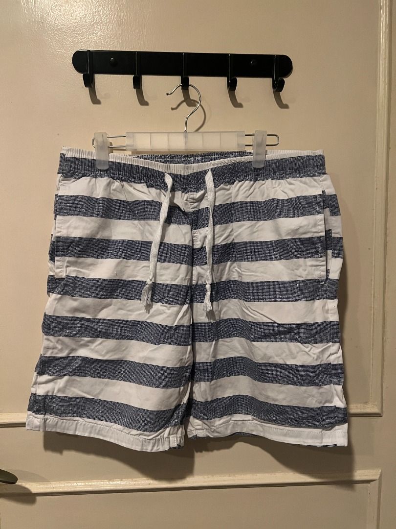 Blue and White Striped Shorts with Drawstring [s8] (Category: Shorts) located in Pasig City. Submitted by awesamfinds (Listing ID 1465841570, Image 1). Description: - Classic blue and white striped design with a stylish textured pattern - Comfortable elastic waistband with an adjustable drawstring - Functional storage with two front pockets and a single back pocket on the right - Casual style ideal for everyday wear, lounging, or warm weather W: 