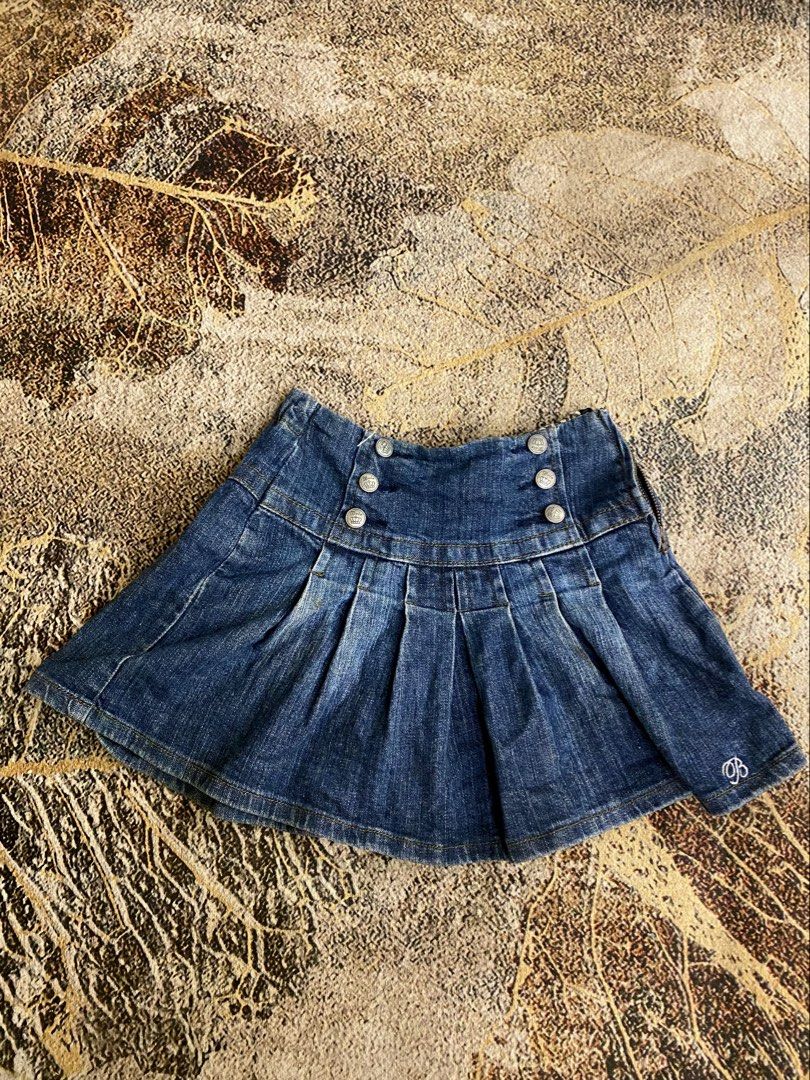 Blue Denim Pleated Mini Skirt with Buttons (Category: Skirts) located in Manila. Submitted by ariane0422 (Listing ID 1465867725, Image 1). Description: - Style: High waist pleated mini skirt with flare cut - Design: Washed finish blue denim with double rows of front silver buttons - Detail: Small embroidered logo near the bottom hem - Closure: Convenient side zipper - Mode of Payment: GCash, BPI, or Bank Transfer - Shipping: Via J&T Express or Sa