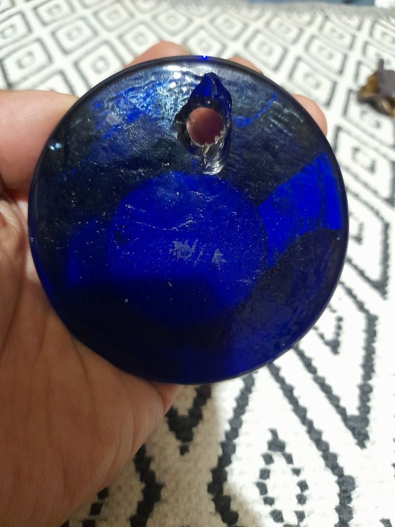 Blue Evil Eye Glass Wall Hanging Talisman (Category: Wall Decor) located in Bocaue. Submitted by marajapansurplus (Listing ID 1465865825, Image 2). Description: - Traditional blue glass evil eye amulet - Features a striking central white, light blue, and black design - Vibrant cobalt blue circular glass piece - Built-in hole near the edge for easy hanging on walls, doors, or windows - Ideal for home protection and good vibes.
