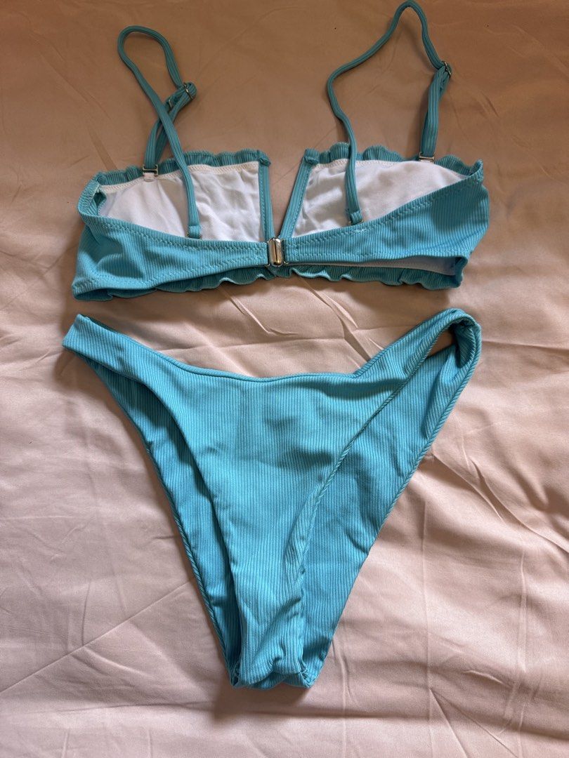 Blue Ribbed Bikini Set Two Piece Swimwear (Category: Bikinis & Swimsuits) located in Dasmarinas. Submitted by pixiesell (Listing ID 1465784937, Image 2). Description: Two-piece bikini set with adjustable shoulder straps, ruffled trim, and a secure metal back closure clasp Silver hardware. Size: Small Used only once..