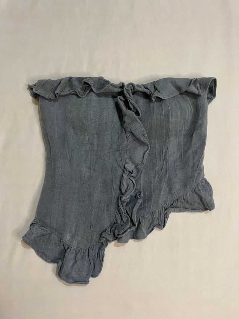 Blue Ruffle Asymmetrical Tube Top (Category: Sleeveless) located in Binan City. Submitted by declutterbyjwy (Listing ID 1465902519, Image 1). Description: - washed denim style - padded - double lining - never used, no flaws.