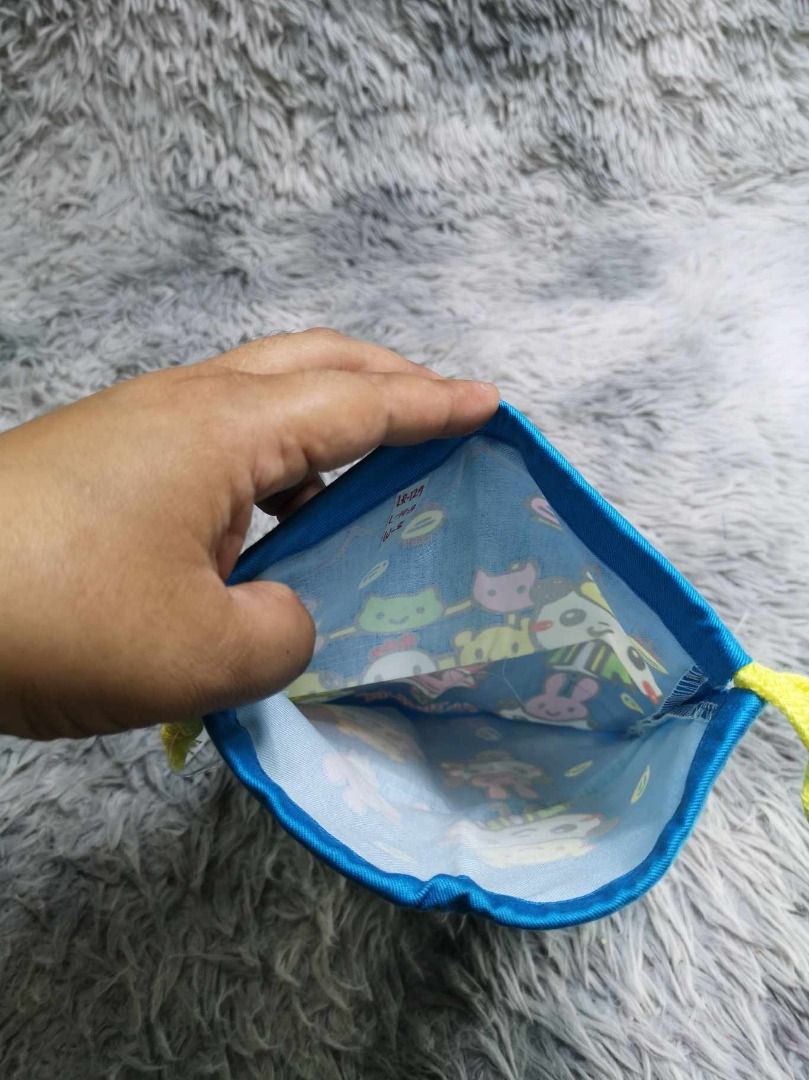 Blue With Yellow String Pouch (Category: Purses & Pouches) located in Santa Cruz. Submitted by jmy_surplus.2 (Listing ID 1465896583, Image 2). Description: Size ; L - 10.3 W - 8 Color ; Blue Type ; Pouch Brand ; No brand Material ; Nylon Style ; Drawstring Blue Printed Design Pouch LR 129 JMY 5 Batch #224.