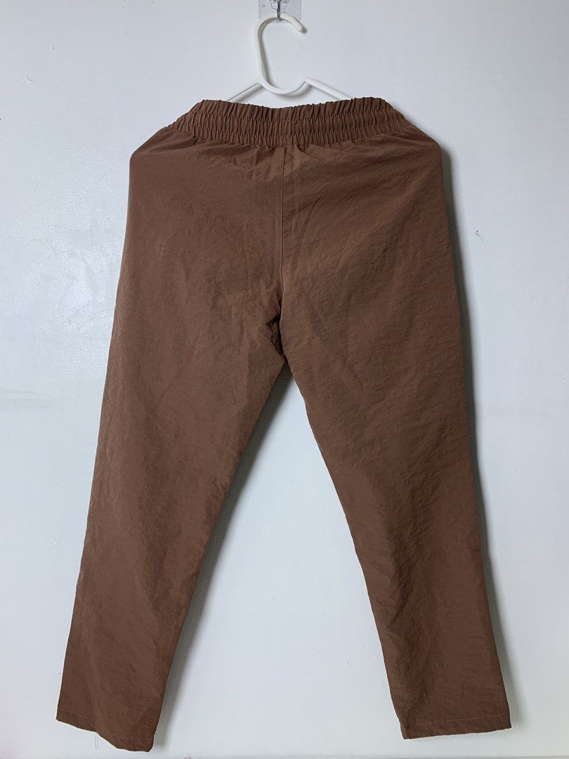 Bny Jeans Brown Jogger Pants Size S (Category: Other Bottoms) located in San Pedro. Submitted by reginacarla (Listing ID 1465791106, Image 2). Description: - Brand: BNY Jeans - Color: Brown - Size: Small - Waist: Elastic with matching drawstring - Pockets: Two functional front pockets - Style: Casual and easy to pair with any top - Comfort: Lightweight fabric ideal for daily wear.