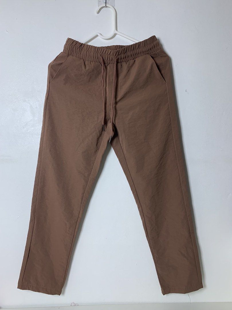 Bny Jeans Brown Jogger Pants Size S (Category: Other Bottoms) located in San Pedro. Submitted by reginacarla (Listing ID 1465791106, Image 1). Description: - Brand: BNY Jeans - Color: Brown - Size: Small - Waist: Elastic with matching drawstring - Pockets: Two functional front pockets - Style: Casual and easy to pair with any top - Comfort: Lightweight fabric ideal for daily wear.