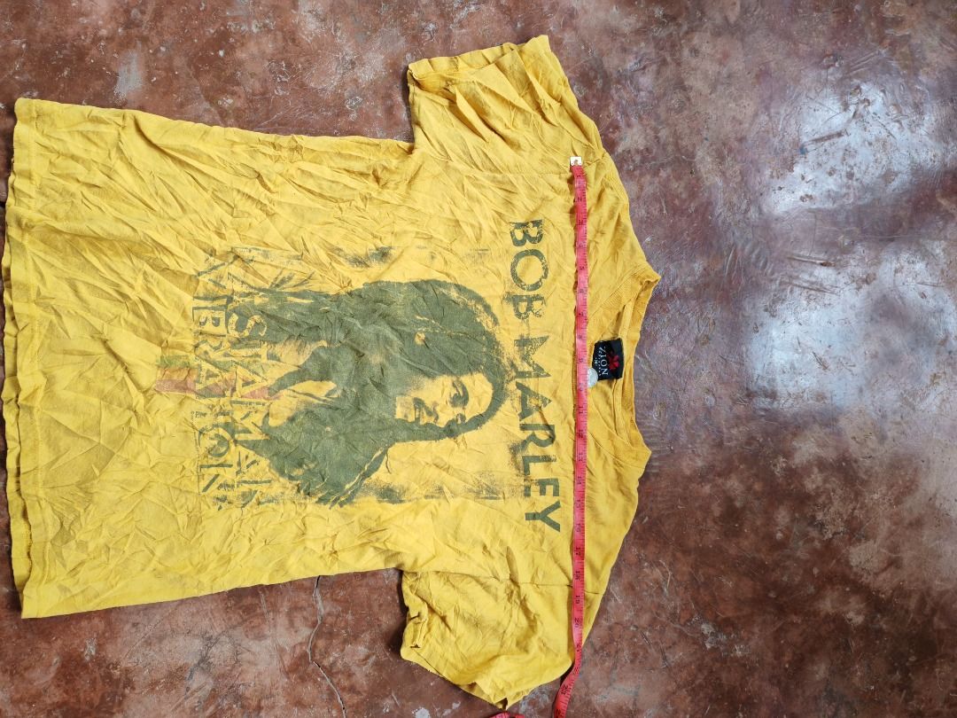 Bob Marley Vintage Graphic Tee Yellow with year 2007 (Category: Tshirts & Polo Shirts ) located in Caloocan City. Submitted by silverbird_6c038f (Listing ID 1465824594, Image 3). Description: - Color: Bright yellow with large Bob Marley front graphic - Fit & Style: Short sleeves, crew neck - Condition: Pre-owned with a cool vintage faded look - Shipping & Meetups: Fast shipping available, PM to order!.