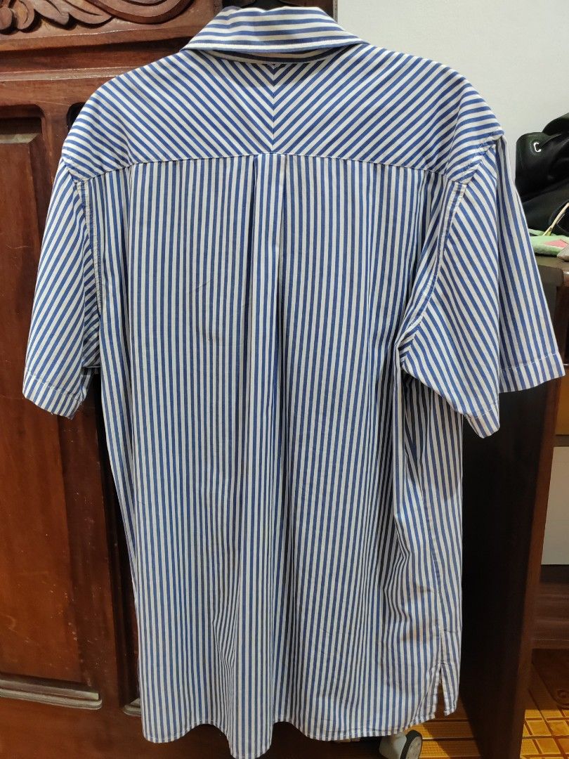 Branded Polo (Category: Tshirts & Polo Shirts ) located in Manila. Submitted by emoralesb46213 (Listing ID 1465883153, Image 2). Description: - Brand: Tommy Hilfiger - Style: Short sleeve button-up shirt - Pattern: Classic blue and white vertical stripes - Fit: Regular fit - Details: Point collar, left chest pocket, front button closure - Condition: Clean and ready to wear - Perfect for smart-casual or everyday warm weather styling TAKE ALL FOR 8