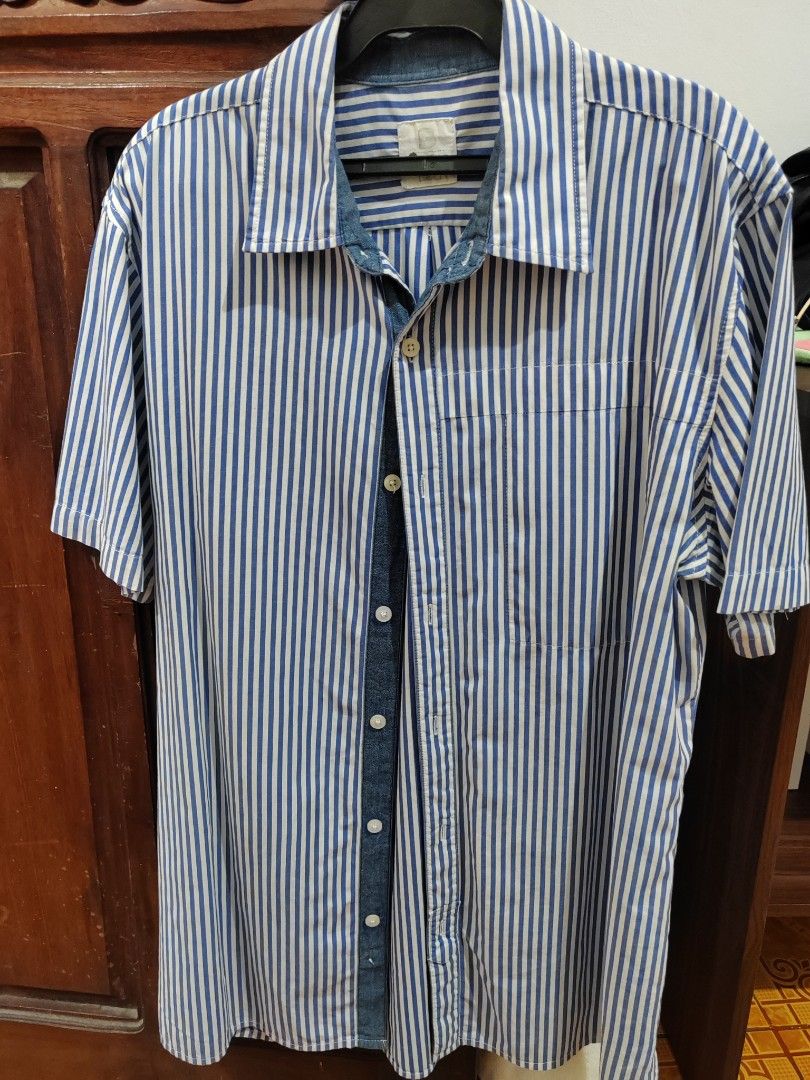 Branded Polo (Category: Tshirts & Polo Shirts ) located in Manila. Submitted by emoralesb46213 (Listing ID 1465883153, Image 1). Description: - Brand: Tommy Hilfiger - Style: Short sleeve button-up shirt - Pattern: Classic blue and white vertical stripes - Fit: Regular fit - Details: Point collar, left chest pocket, front button closure - Condition: Clean and ready to wear - Perfect for smart-casual or everyday warm weather styling TAKE ALL FOR 8