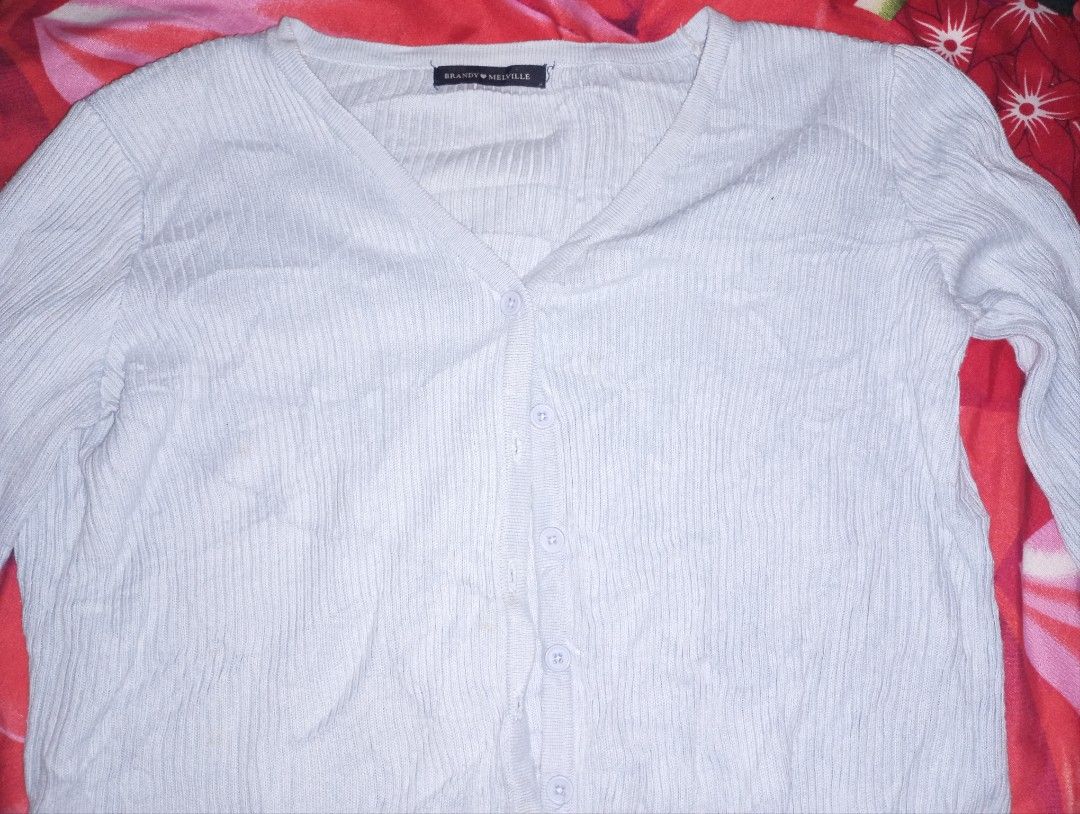 Brandy Melville Light Blue Cardigan (Category: Coats, Jackets and Outerwear) located in Quezon City. Submitted by awhdri (Listing ID 1465773746, Image 2). Description: - Brand: Brandy Melville - Style: Light blue ribbed cardigan with V-neck and front buttons - Fit: Cropped length with long sleeves - Material: Soft and lightweight knit fabric - Size: S-M .