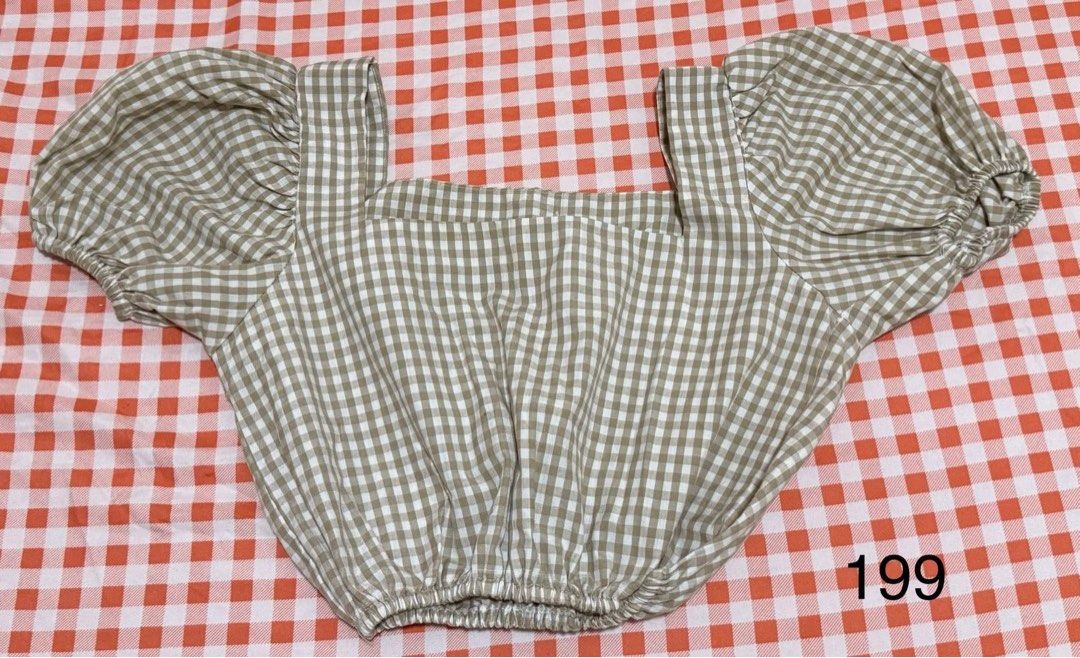 Brown Gingham Square Neck Crop Top Puff Sleeves (Category: Blouses) located in Quezon City. Submitted by itsmesummeeer (Listing ID 1465944032, Image 1). Description: - Brown and white gingham crop top - Square neckline with wide straps - Short puff sleeves with elastic cuffs - Lightweight fabric, perfect with high-waisted jeans or skirts - Chest: 17”.