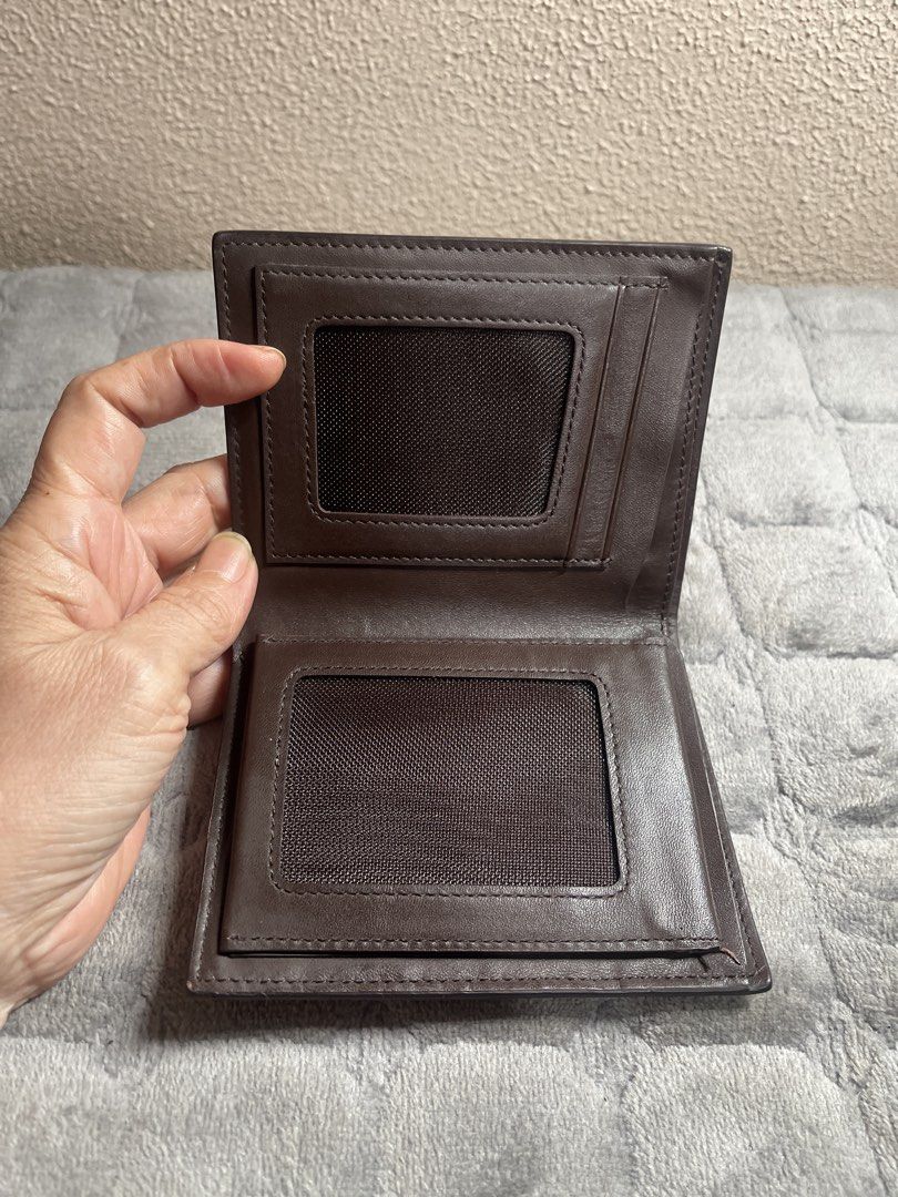 Brown Men's Bifold Leather Wallet with ID Windows (Category: Wallets & Card Holders) located in Quezon City. Submitted by donnabelle7572 (Listing ID 1465937246, Image 3). Description: - Material: Premium brown leather with a mixed woven and textured exterior panel design - Interior Layout: Multiple card slots, slip pockets, ID windows, and a spacious cash compartment - Lining: Clean interior lining featuring a visible branding stamp - Usage: Perf