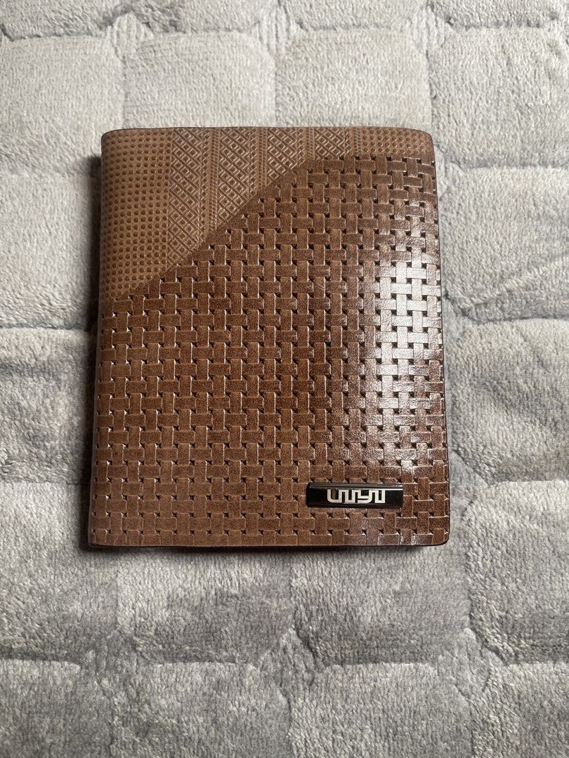 Brown Men's Bifold Leather Wallet with ID Windows (Category: Wallets & Card Holders) located in Quezon City. Submitted by donnabelle7572 (Listing ID 1465937246, Image 1). Description: - Material: Premium brown leather with a mixed woven and textured exterior panel design - Interior Layout: Multiple card slots, slip pockets, ID windows, and a spacious cash compartment - Lining: Clean interior lining featuring a visible branding stamp - Usage: Perf