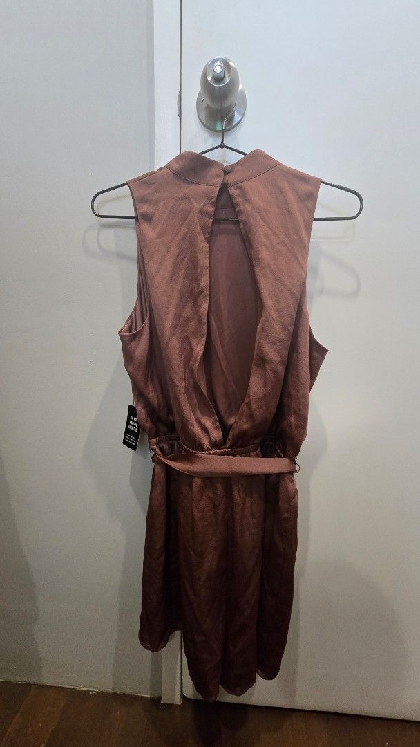 Brown Sleeveless Romper (Category: Rompers) located in Cebu City. Submitted by kitty_12345_ (Listing ID 1465847197, Image 3). Description: - Color: Brown - Style: Sleeveless romper with shorts cut - brand new, still with tag and extra button MOP: Gcash, mari, maya, gotyme MOD: Lbc Meetup: Parkmall.