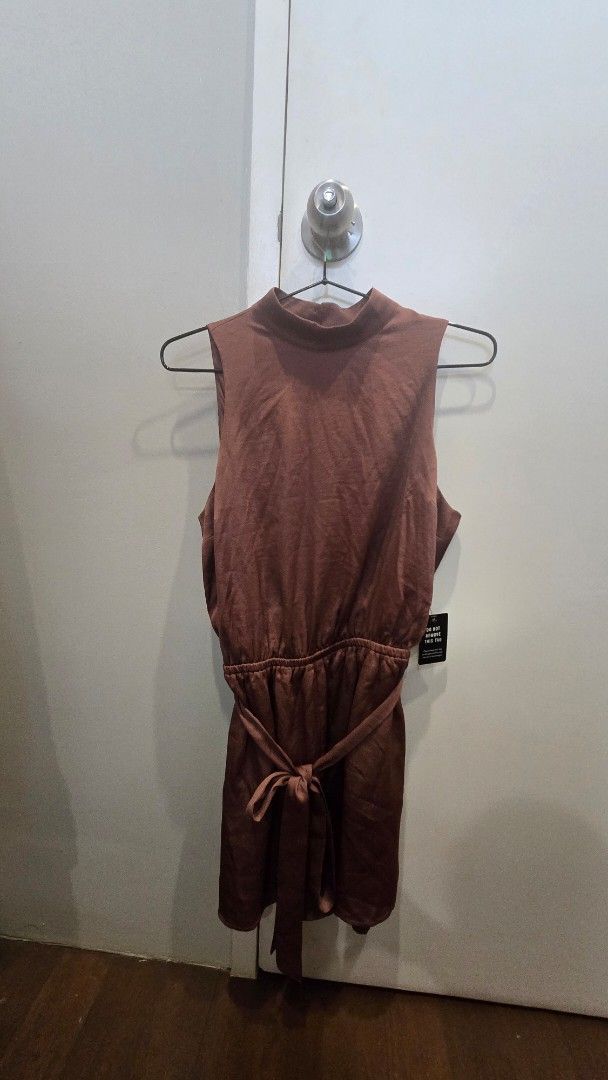 Brown Sleeveless Romper (Category: Rompers) located in Cebu City. Submitted by kitty_12345_ (Listing ID 1465847197, Image 2). Description: - Color: Brown - Style: Sleeveless romper with shorts cut - brand new, still with tag and extra button MOP: Gcash, mari, maya, gotyme MOD: Lbc Meetup: Parkmall.
