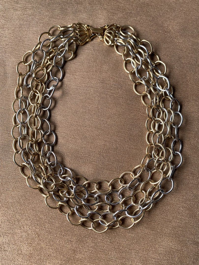 Brutalist statement necklace (Category: Necklaces) located in Cebu City. Submitted by janb85 (Listing ID 1465849595, Image 2). Description: A multi-strand, mixed-metal chunky chain necklace featuring interlinked oval loops in alternating gold and silver tones. A perfect edgy piece that allows you to mix your metals for a statement look..