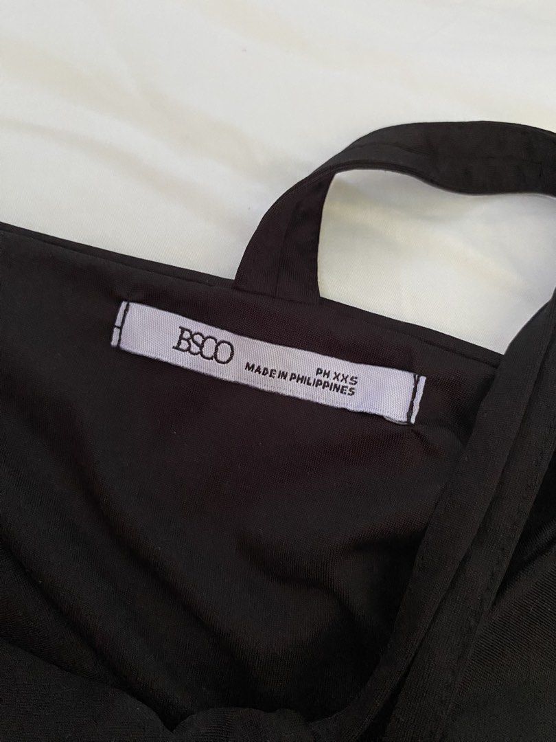 BSCO Black High Neck Tank Top (Category: Sleeveless) located in Angeles City. Submitted by declutteredbyglai (Listing ID 1465833342, Image 3). Description: - Never been used 😞 - Color: Black - Style: High neck, racerback, minimal basic - Material: Soft and stretchy.