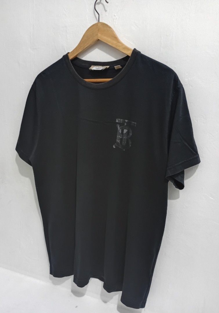 Burberry Black TB Monogram T-Shirt (Category: Luxury Apparel) located in Navotas City. Submitted by ms.soulana (Listing ID 1465496375, Image 1). Description: PREOWNED LIKENEW Burberry TB monogram logo Mens Cotton TShirt -Black -XL W23"X L28" - 100% premium cotton, made in Italy - Classic crew neck and standard short sleeve fit - Comfortable everyday wear with subtle luxury branding - Min Sign of Used Good Condition 9/10.